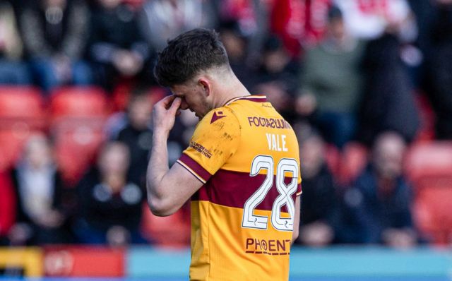 Motherwell's Jack Vale looks dejected after his shown a red card during a cinch Premiership match between Aberdeen and Motherwell at Pittodrie Stadium