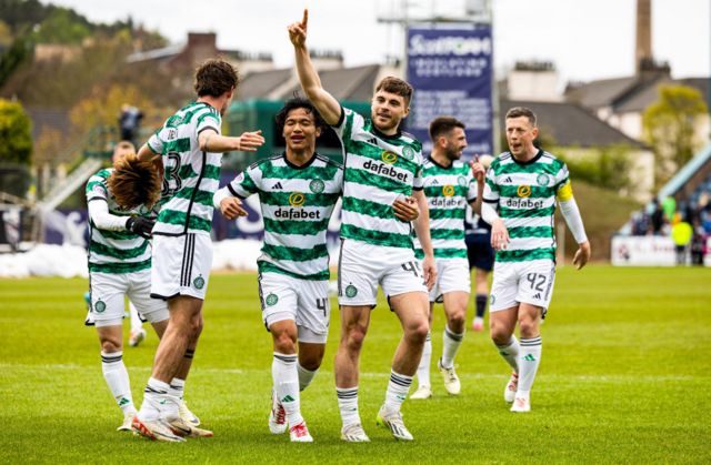 Celtic's James Forrest celebrates with Reo Hatate after scoring to make it 1-0 during a cinch Premiership match between Dundee and Celtic at Scot Foam Stadium at Dens Park, on April 28, 2024, in Dundee, Scotland.