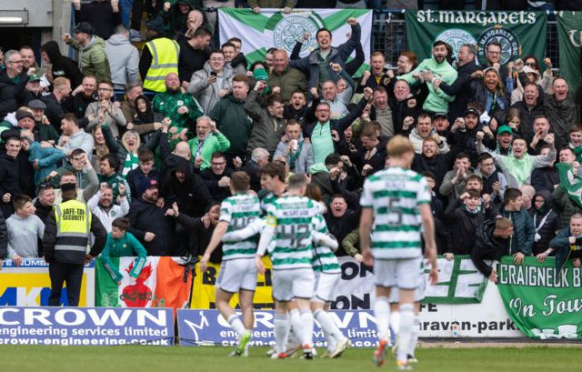 Celtic fans celebrates after James Forrest scores to make it 1-0 during a cinch Premiership match between Dundee and Celtic at Scot Foam Stadium at Dens Park, on April 28, 2024, in Dundee, Scotland.