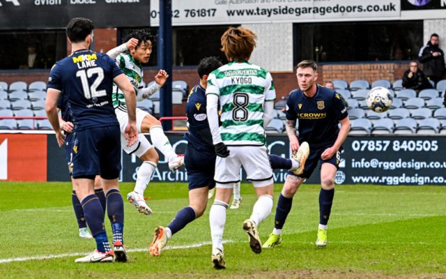 Celtic's Reo Hatate has a shot off target during a cinch Premiership match between Dundee and Celtic at Scot Foam Stadium at Dens Park, on April 28, 2024, in Dundee, Scotland.