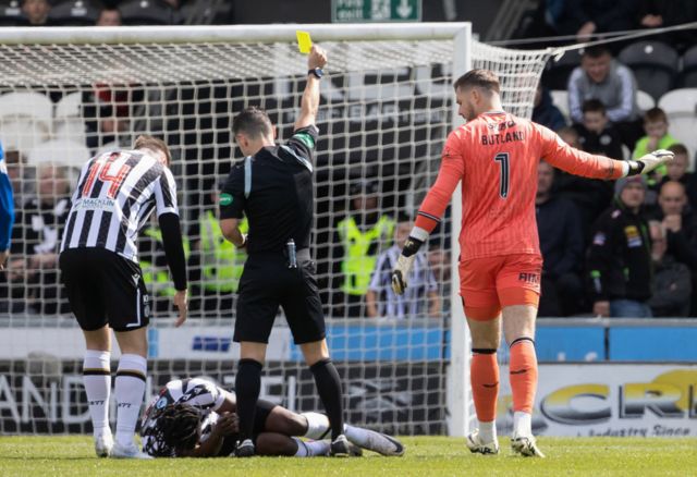 Rangers' Jack Butland is shown a yellow card by referee Nick Walsh during a cinch Premiership match between St Mirren and Rangers at SMiSA Stadium, on April 28, 2024, in Paisley, Scotland.