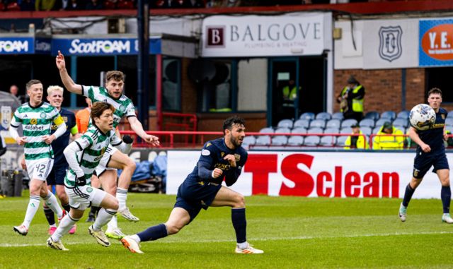 Celtic's James Forrest scores to make it 1-0 during a cinch Premiership match between Dundee and Celtic at Scot Foam Stadium at Dens Park, on April 28, 2024, in Dundee, Scotland.