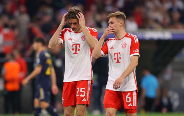 Muller and Kimmich react in a disappointed manner at the full time whistle