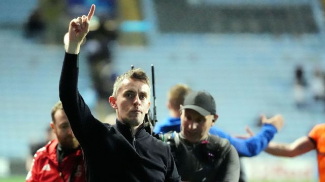 Kieran McKenna celebrates in front of Ipswich's supporters