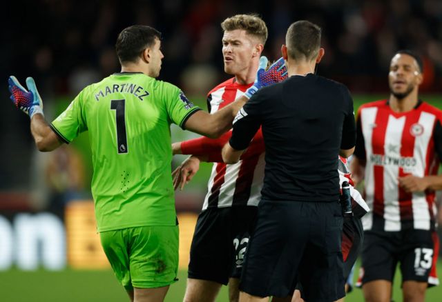 Aston Villa goalkeeper Emi Martinez argues with Brentford's Nathan Collins