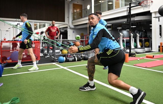 Gabriel Jesus stretches in the gym