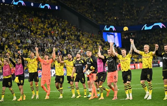 Dortmund players celebrate with their fans