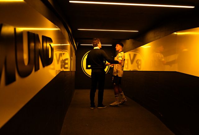 Edin Terzic, Head Coach of Borussia Dortmund, and Jadon Sancho of Borussia Dortmund interact inside the players tunne