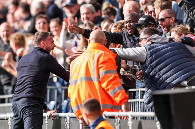 Head Coach Rob Edwards of Luton Town celebrates with fans
