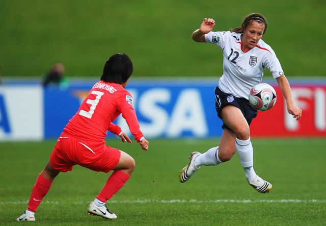 Lucy Bronze of England (R) controls the ball