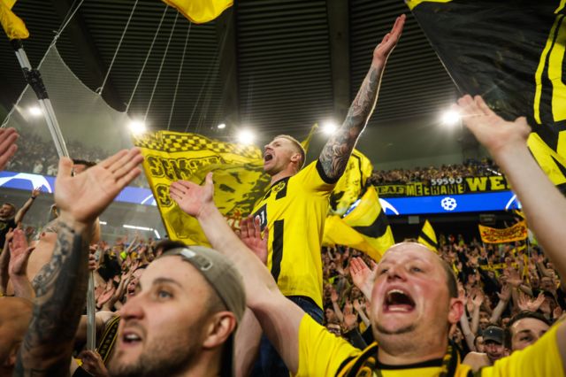 Borussia Dortmund fans celebrate after watching their side beat Paris St-Germain to reach the Champions League final