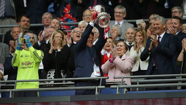 Louis van Gaal lifts the FA Cup