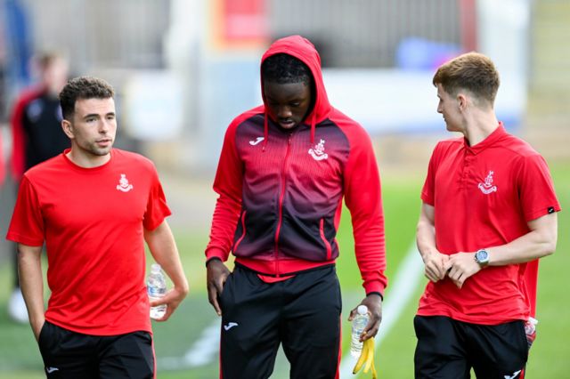 irdrie's Adam Frizzell, Kanayo Megwa and Liam McStravick (L-R) arrive before a cinch Premiership Play-Off Quarter-Final 2nd Leg match between Partick Thistle and Airdrieonians at the Wyre Stadium at Firhill, on May 10, 2024, in Glasgow, Scotland.