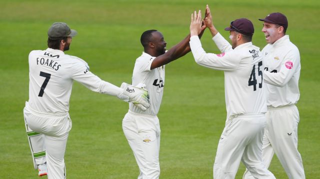 Surrey celebrate a wicket