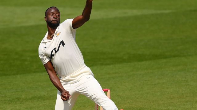 Kemar Roach bowls for Surrey