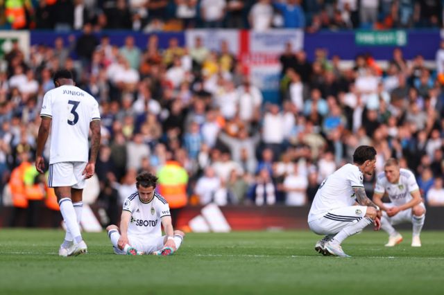 Dejected players of Leeds United after being relegated