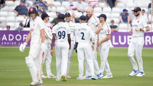 Warwickshire celebrate taking wicket