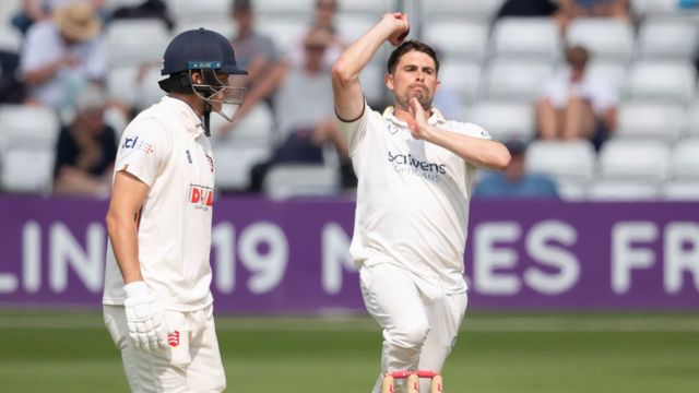 Will Rhodes bowling for Warwickshire