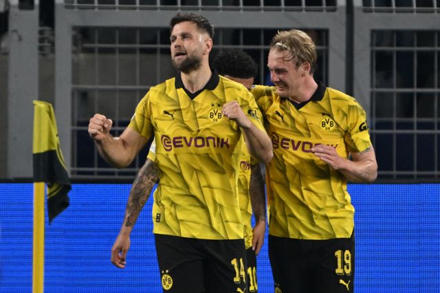 Niclas Fullkrug celebrates scoring against Paris St-Germain