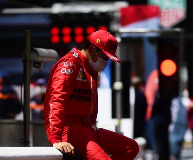 Charles Leclerc looks dejected after is unable to start his home race in Monaco in 2021