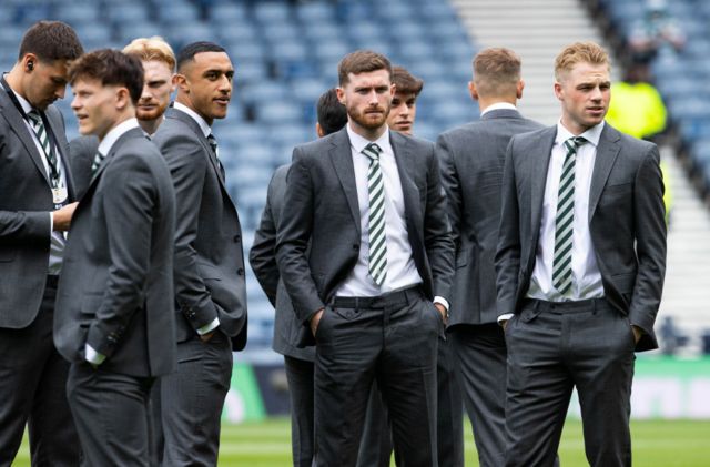 Celtic players gather on the Hampden pitch