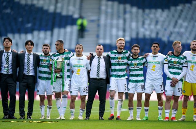 Celtic players and staff take in the rendition of You'll Never Walk Alone