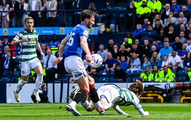 Rangers' Ben Davies (L) and Celtic's Kyogo Furuhashi in action during a Scottish Gas Scottish Cup final match between Celtic and Rangers at Hampden Park, on May 25, 2024, in Glasgow, Scotland.