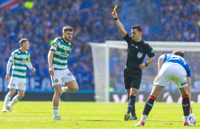 Referee Nick Walsh shows Celtic's James Forrest a yellow card during a Scottish Gas Scottish Cup final match between Celtic and Rangers at Hampden Park, on May 25, 2024, in Glasgow, Scotland.