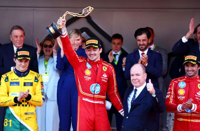 Race winner Charles Leclerc of Monaco and Ferrari celebrates with Prince Albert of Monaco