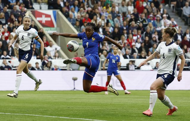 France's Marie-Antoinette Katoto in action with England's Leah Williamson and Keira Walsh