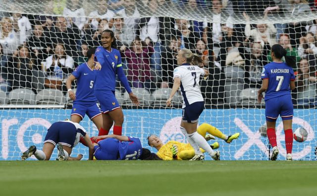 England's Beth Mead celebrates scoring their first goal