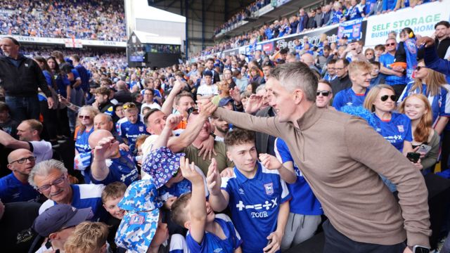 Kieran McKenna celebrates winning promotion with Ipswich fans