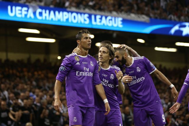 Cristiano Ronaldo, Luka Modric and Karim Benzema of Real Madrid celebrate winning the Champions League