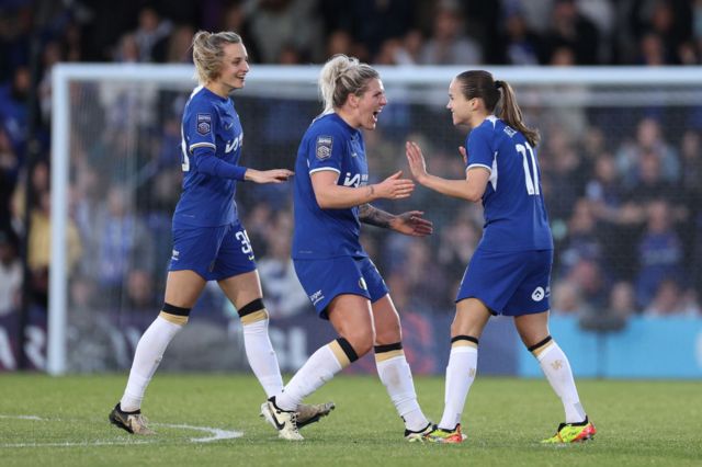 Chelsea players celebrate after Reiten's fourth goal