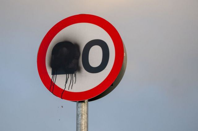 A defaced 20mph sign
