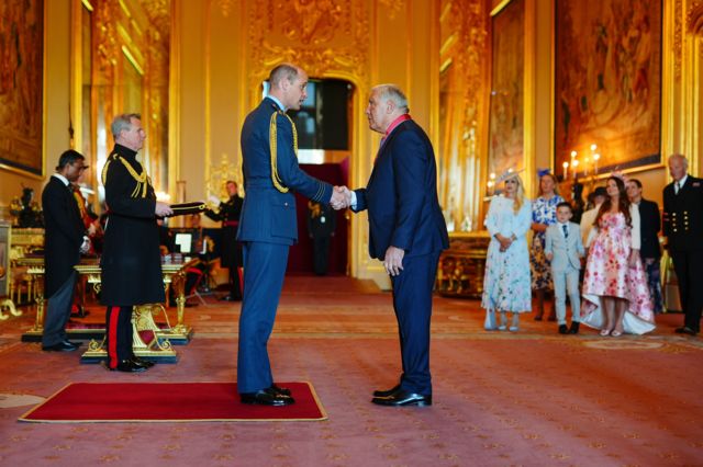 Peter Shilton shakes hands with Prince William at Windsor Castle