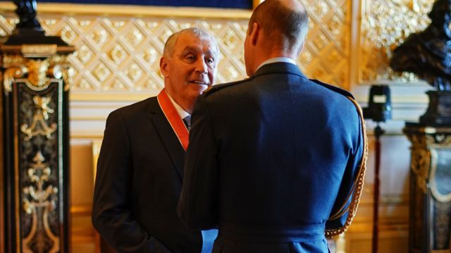 Peter Shilton chats with Prince William at Windsor Castle after being awarded his CBE