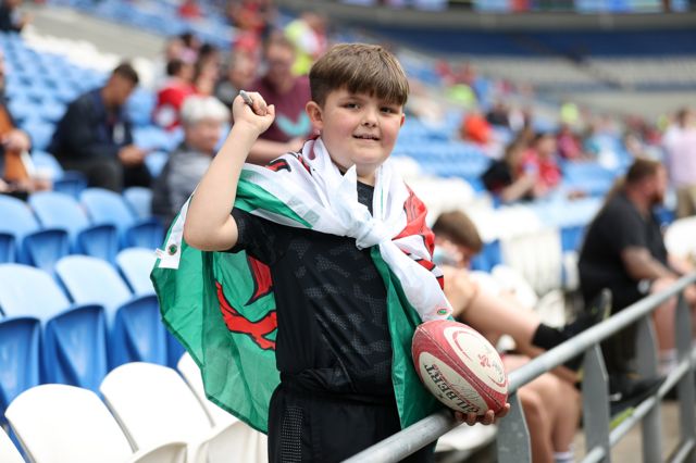 Boy wearing Wales flag