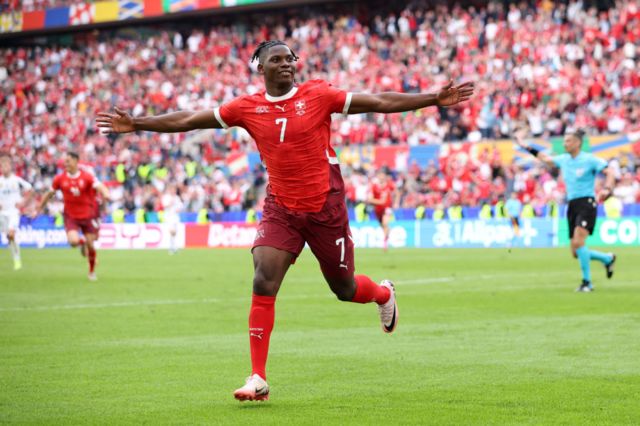 Breel Embolo of Switzerland celebrates scoring his team's third goal during the UEFA EURO 2024 group stage match between Hungary and Switzerland at Cologne Stadium