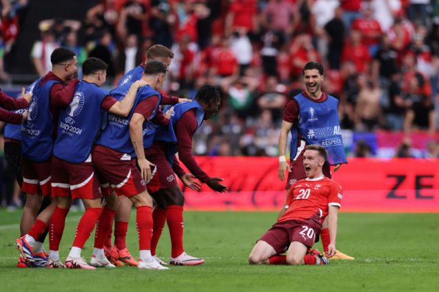 Michel Aebischer of Switzerland celebrates scoring his team's second goal with teammates during the UEFA EURO 2024 group stage match between Hungary and Switzerland at Cologne Stadium