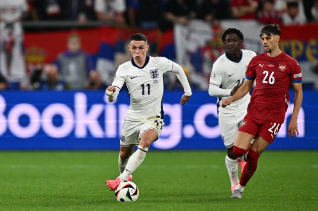 Phil Foden dribbles with the ball