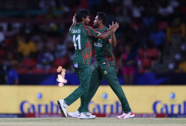 Tanzim Hasan Sakib of Bangladesh celebrates with teammate Shakib Al Hasan after dismissing Kushal Bhurtel of Nepal (not pictured) during the ICC Men's T20 Cricket World Cup West Indies & USA 2024 match