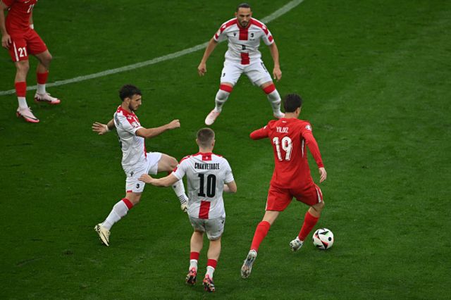 Turkey's forward #19 Kenan Yildiz runs with the ball