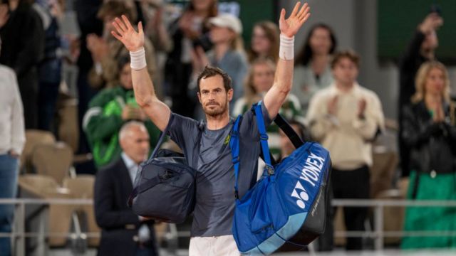 Andy Murray waves to the crowd at the French Open