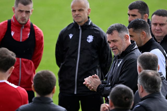 Willy Sagnol speaks with his players during a training session