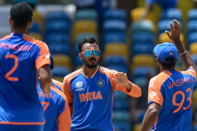 India's Axar Patel (C) celebrates the dismissal of Afghanistan's Ibrahim Zadran during the ICC men's Twenty20 World Cup 2024 Super Eight cricket match between Afghanistan and India at Kensington Oval in Bridgetown, Barbados