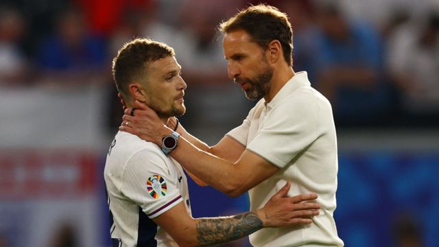 Manager Gareth Southgate embraces Kieran Trippier after England's 1-1 draw with Denmark at Euro 2024