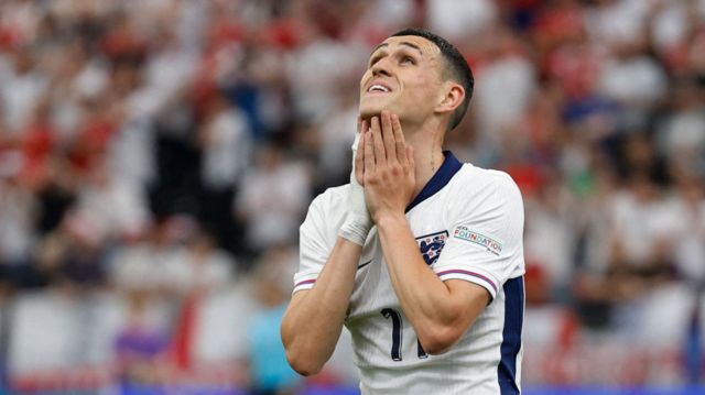 Phil Foden grimaces during England's draw with Denmark at Euro 2024