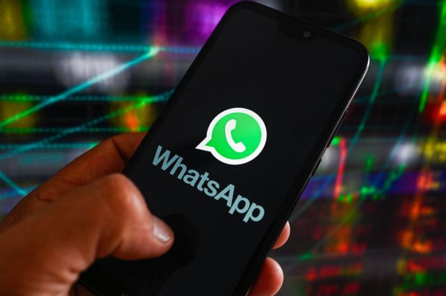 The WhatsApp logo on a phone