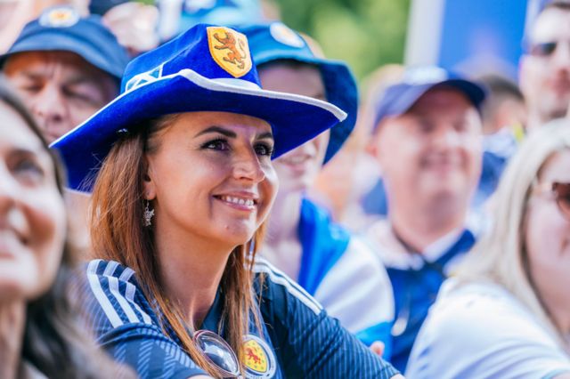 A female fan wears a Scotland cowboy hat at a fan gathering in Stuttgart